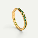 Round ring with green stones and gold
