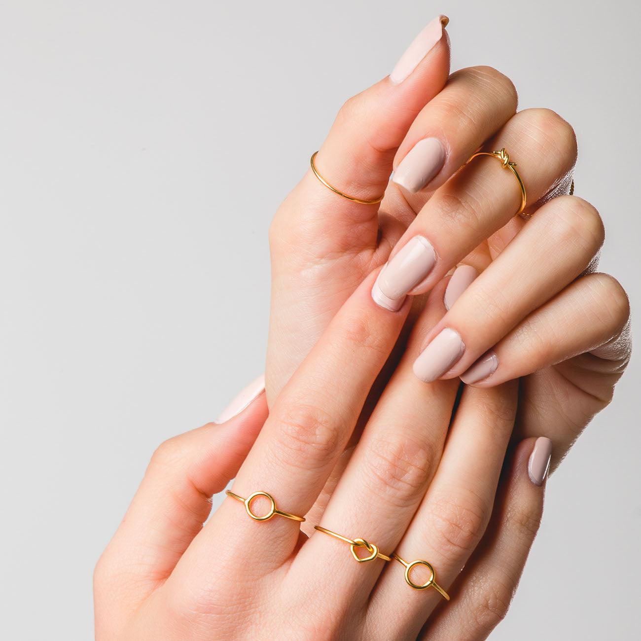 Hands with several Circle Gold rings
