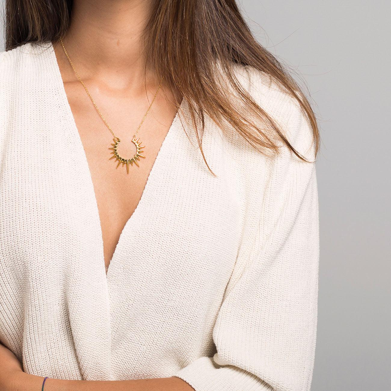 Woman with Elysse Gold necklace. Adamina