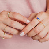 Hands with Coretta Silver ring and other rings with zirconia by Adamina