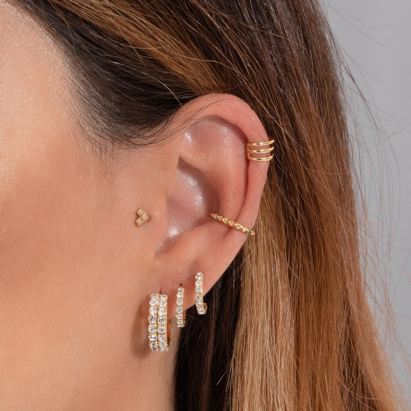 Model posing with Gold Plated Sterling Silver 925 Ice Earrings with White Zircons