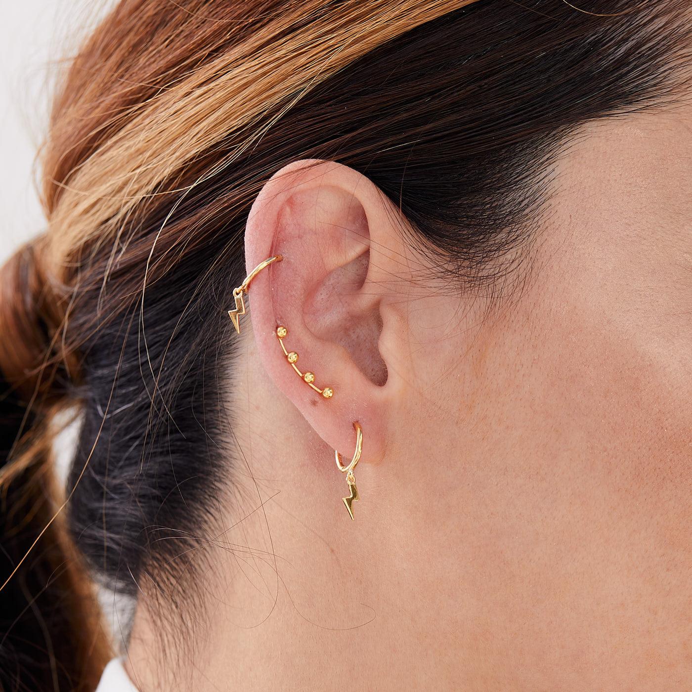 Model posing with Gold Plaiting Sterling Silver 925 Hoops Ray Earrings