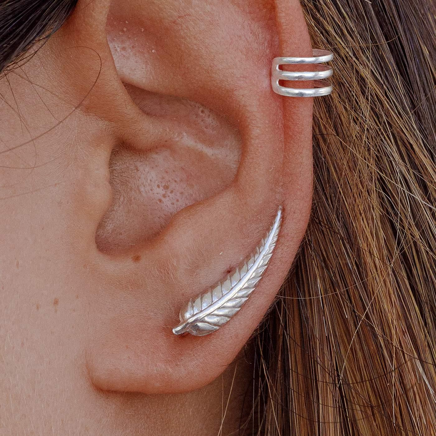 Ear with Soft Silver earring and another silver earring from Adamina's collection.