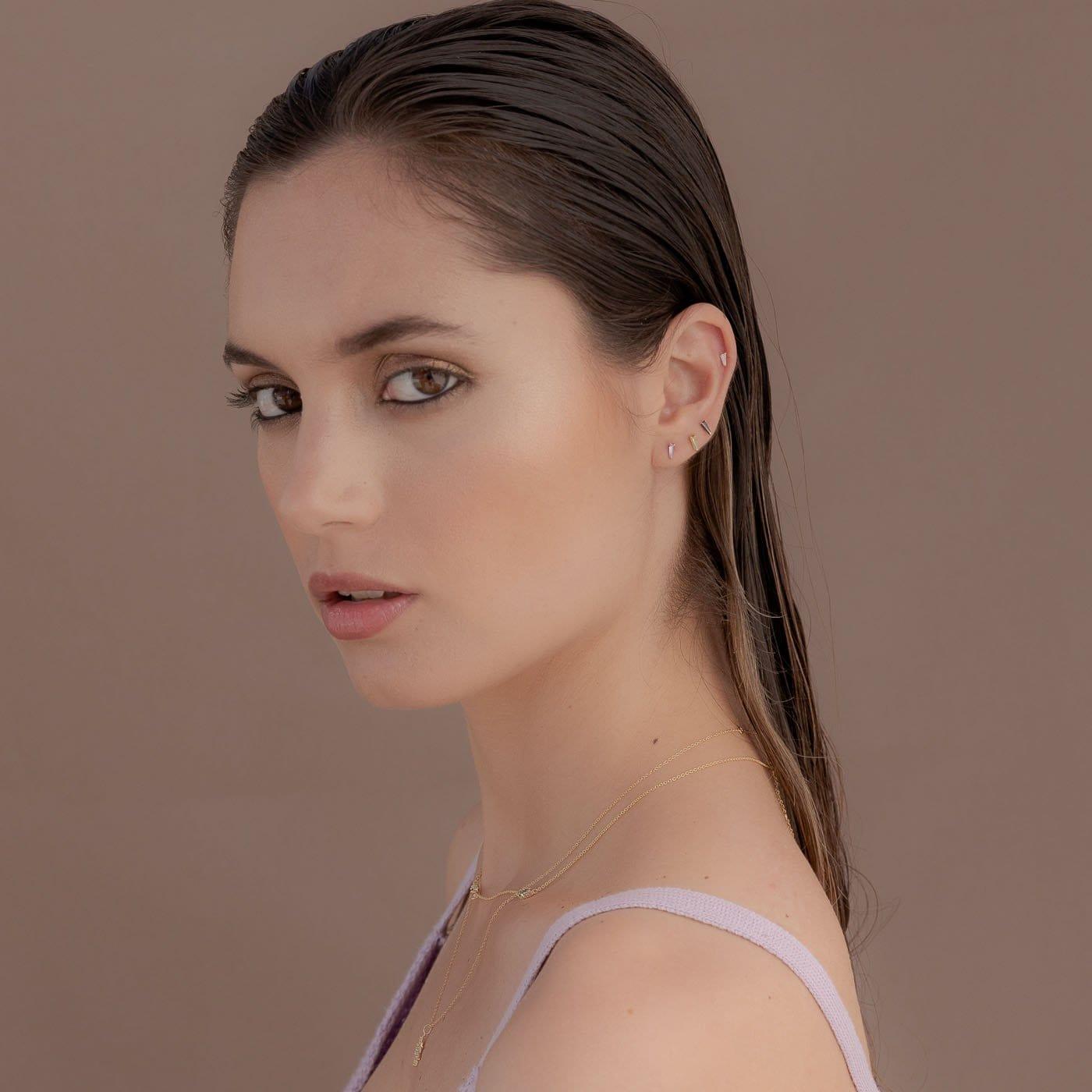 Model posing with Nib Mini Gold Plated 925 Sterling Silver with Black Zirconia Earrings