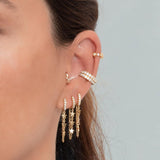 Orecchini Arla in argento 925 placcato oro con zirconi colorati accompagnati da orecchini della collezione Arla Ear Cuff.