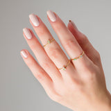 Hand with three Enid Gold rings