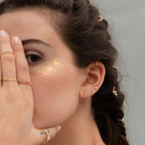 Model posing with Gold Plaiting Sterling Silver 925 Hydra Earrings with White Zirconias
