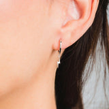 Model posing with 925 Sterling Silver Hoops Ray Earrings