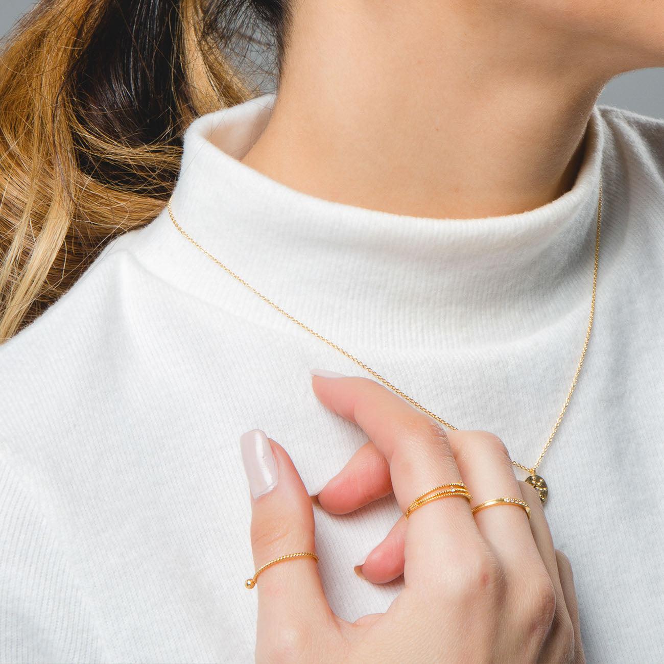 ANELLO CON PUNTI IN ORO ROSA