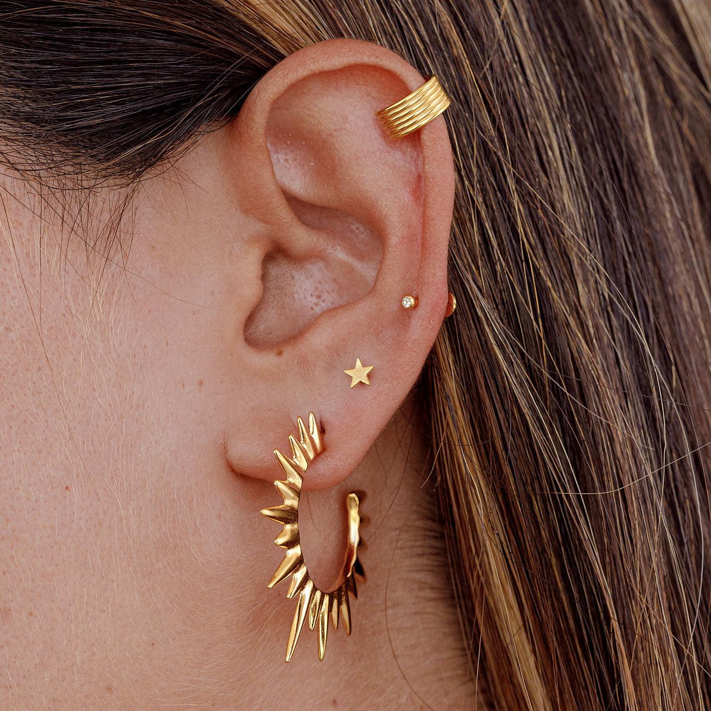 PIERCING IN ORO ASTERI